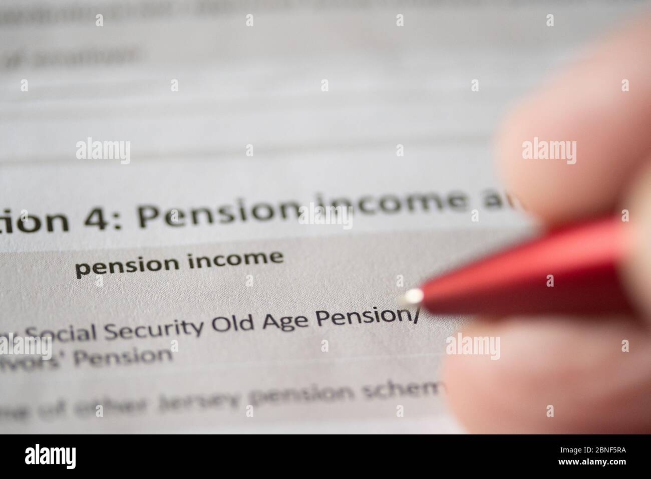 A Person Filling Out Pension Income Details On A Personal Income Tax 